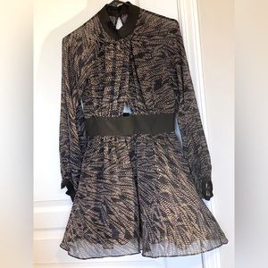 BCBGeneration sheer long sleeves ribbon trimmed keyhole skater style dress.
